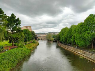 Fototapeta na wymiar river with bridge and park