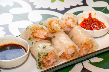 A plate of delicious Cantonese morning tea dim sum crispy shrimp rice rolls