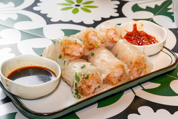 A plate of delicious Cantonese morning tea dim sum crispy shrimp rice rolls