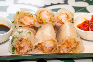 A plate of delicious Cantonese morning tea dim sum crispy shrimp rice rolls