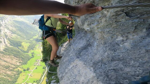 Via Ferrata from Murren to Gimmelwald. Risky rock climbing on Swiss Alps.