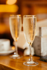 two glasses of champagne on table, celebration of the celebration. preparation for the new year. new year's night. valentine's day. romantic atmosphere 
