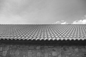 Fototapeta premium tiles on the roof, the lines of which go to the sky and the distance