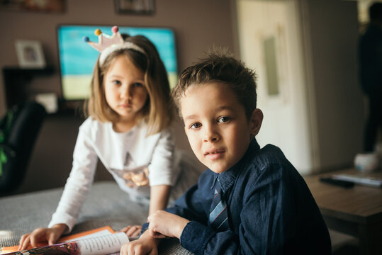 Brother and sister at home.