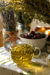Morning still life with herbs and fruits. Tea time at breakfast. In the summer in the south