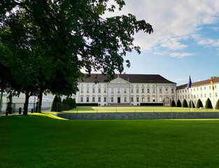 Bellevue Palace exterior with green grass glade on a summer day in Tiergarten district of Berlin, Germany