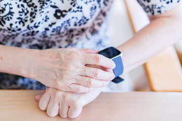 Japanese senior woman using smart watch