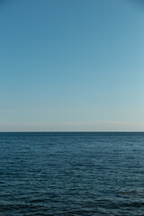 Blue sky and endless sea. View of the open ocean.