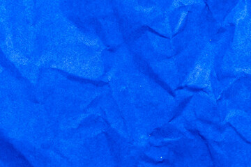 Grunge wrinkled blue color paper textured background
