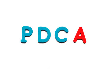 Alphabet letter with word PDCA (abbreviation of plan do check act) on white board background