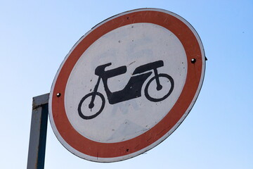 Dutch road sign: no access for mopeds, motor-assisted bicycles or motor-powered invalid carriages