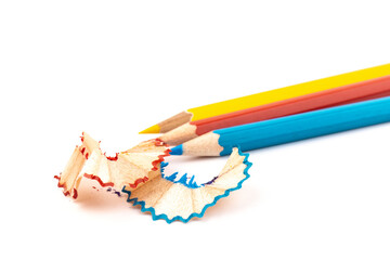 Wooden pencil whith shavings and colorful crumbs of graphite from sharpener. Back to school concept.