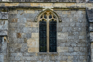 Naklejka premium Medieval window in stone wall