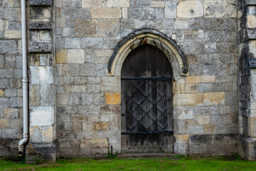 Fototapeta na wymiar Medieval doorway in stone wall