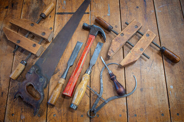 Workbench in wood shop with variety of old wood working tools