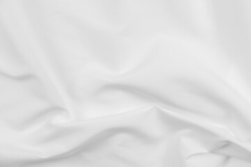 Abstract white fabric texture background. Cloth soft wave. Creases of satin, silk, and cotton.