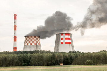 Pollution of the environment, ecology and atmosphere. Dirty production. Gray smoke is emitted from...