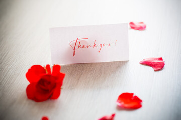 bouquet of beautiful red roses in a basket on table