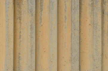 textured material with straight lines and different depths for graphic design. wall with yellow tones without sanding