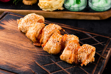 Pizza Calzone folded as a patty on a wooden board table