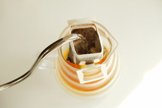 Drip bag coffee brewing process top view. Easy simple brew method, new trend