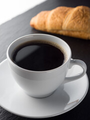 Cup of coffe and croissants