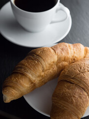 Cup of coffe and croissants