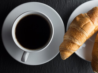 Cup of coffe and croissants