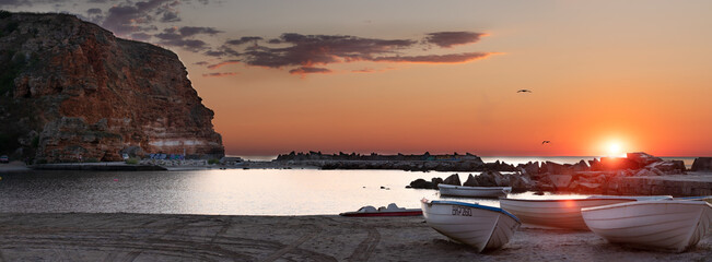 Sunrise on the beach. Boat on the beach. Sunrise on the beach. Boat on the beach. Beach Bolata, Bulgaria.