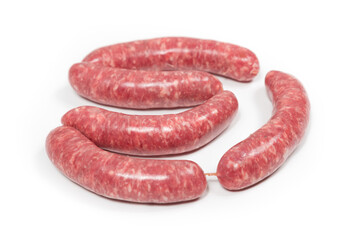 Five crude sausages on a white background