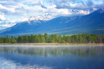 Landscape with mountains reflecting in the water. Buryatia, Tunkinskaya valley