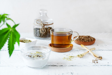Hemp products: tea, seeds shelled and whole, yogurt with seeds, cannabis plant