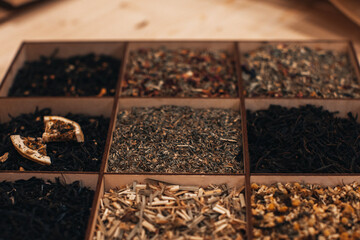 Various types of tea leaves in a wooden box