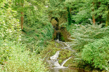 Clapham Falls, a man made waterfall in the village of Clapham in the Yorkshire Dales, shot in landscape in summer