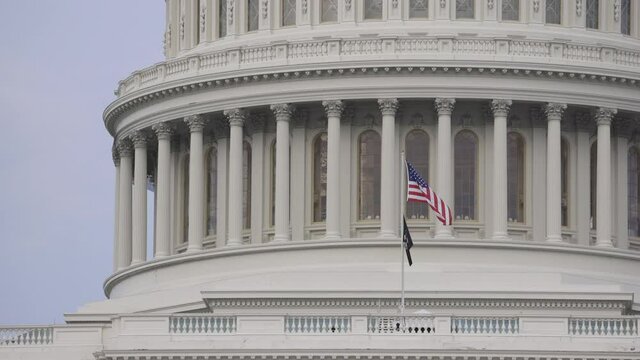 Slow Motion US flag waiving the US Capitol building