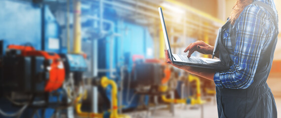 Interior of the boiler room with gas disassembled boiler and pipes for supplying gas and steam. Blue tonting. Panoramic view