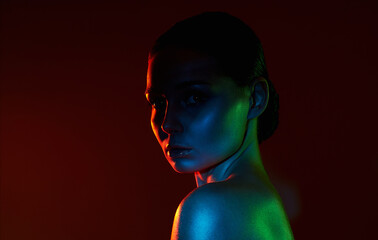 Female silhouette, beautiful woman in color lights