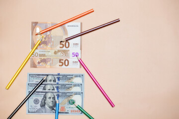 Colored pencils indicate different colors on paper currency