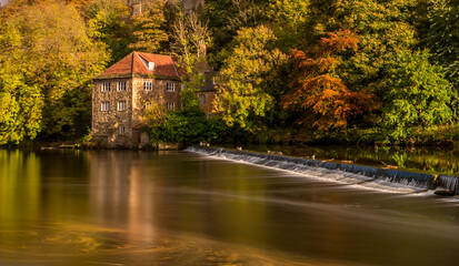 A long exposure of the beautiful Durham Cathedral and the Old Fulling Mill, with the autumn colors reflecting in the River Wear