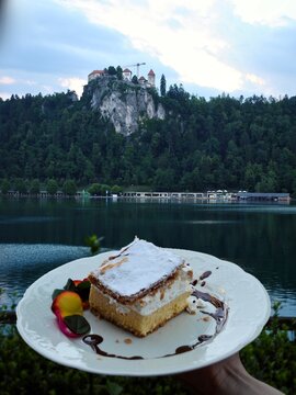 Lake Bled, the Bled Castle and the area's culinary specialty, a cream pastry (kremna rezina or krem&scaron;nita Cremeschnitte). Designated a protected dish of designated origin by the Slovene government.