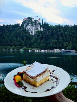 Lake Bled, the Bled Castle and the area's culinary specialty, a cream pastry (kremna rezina or krem&scaron;nita Cremeschnitte). Designated a protected dish of designated origin by the Slovene government.