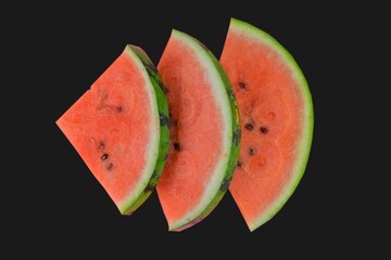 Sliced watermelon on black background. Pieces of watermelon isolated on black background. Flat lay