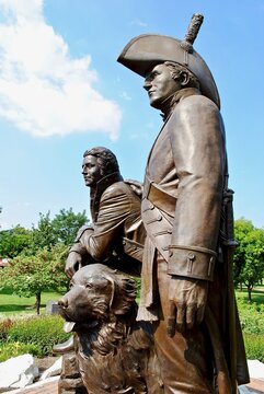 St. Charles, Missouri, USA: Lewis and Clark statue in Frontier Park near Missouri River. A bronze monument features Meriwether Lewis and William Clark and Clark's Newfoundland dog, Seaman.