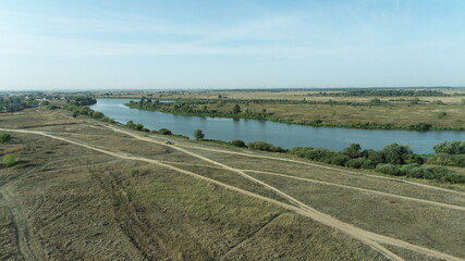 Aerial view of the roads along the river and meadow