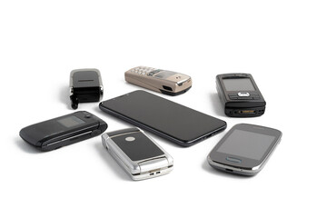 Old mobile phones close-up isolated on white background with shadow