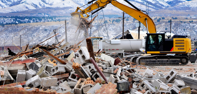 Heavy Equipment Tearing Down Building Construction