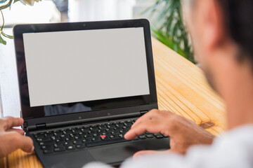 Male Hands At Laptop.Unrecognizable Person Teleworking At Home.
One Man Sitting At Wooden Table And Typing On Laptop. Close-up Hands Of Entrepreneur At Work. Concept Of Business. 