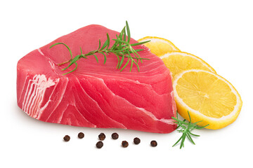 Fresh tuna fish fillet steak with rosemary, lemon and peppercorns isolated on white background with clipping path and full depth of field
