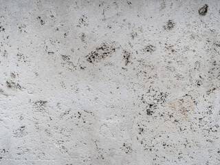 White cracked wall abstract background texture pattern.