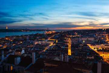 Scenic panoramic view of the downtown of the city of Lisbon at sunset, with the Tagus River on the background, in Portugal.